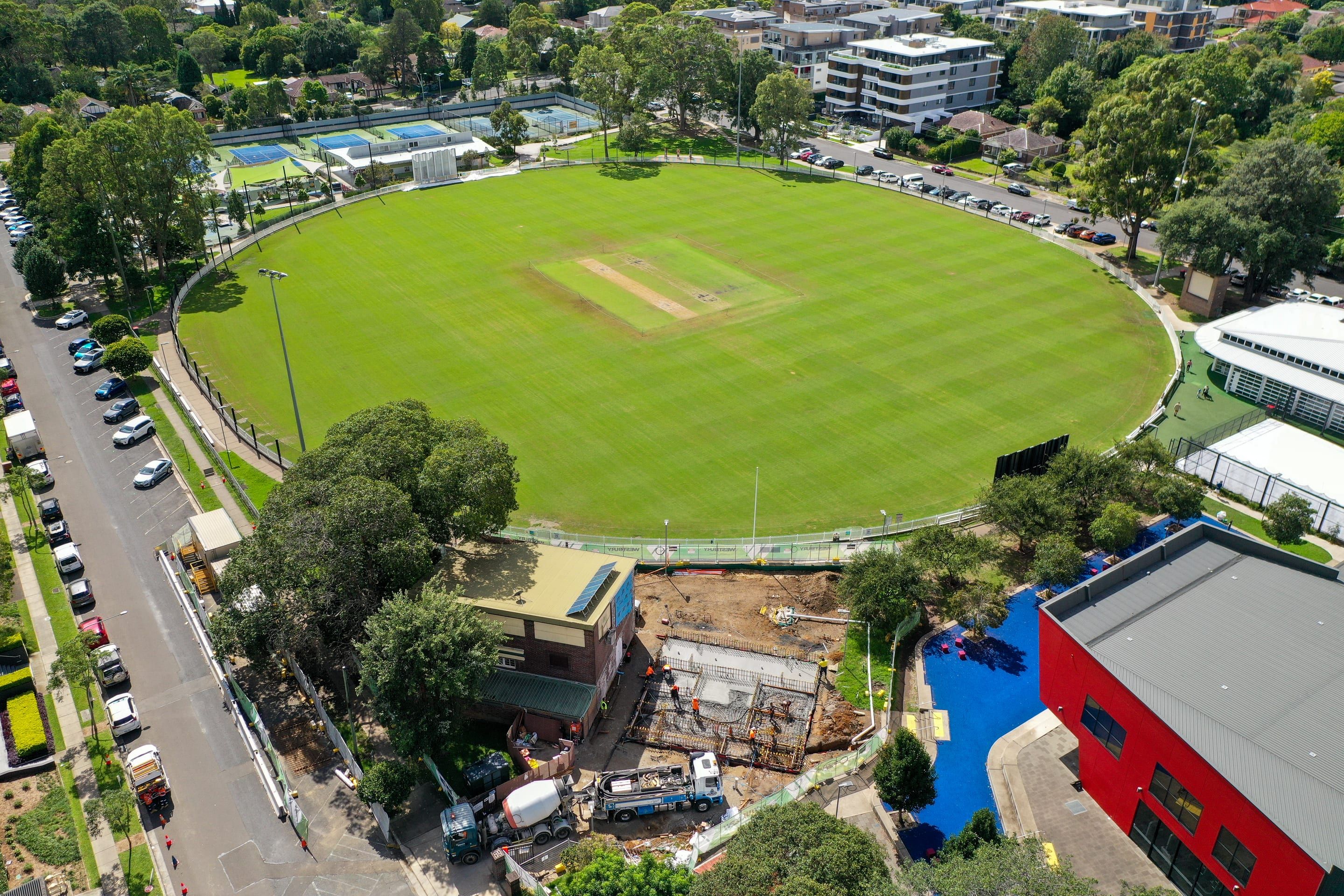Aerial view of the Waitara site beside a cricket oval, the pump truck and agitators on the access road below