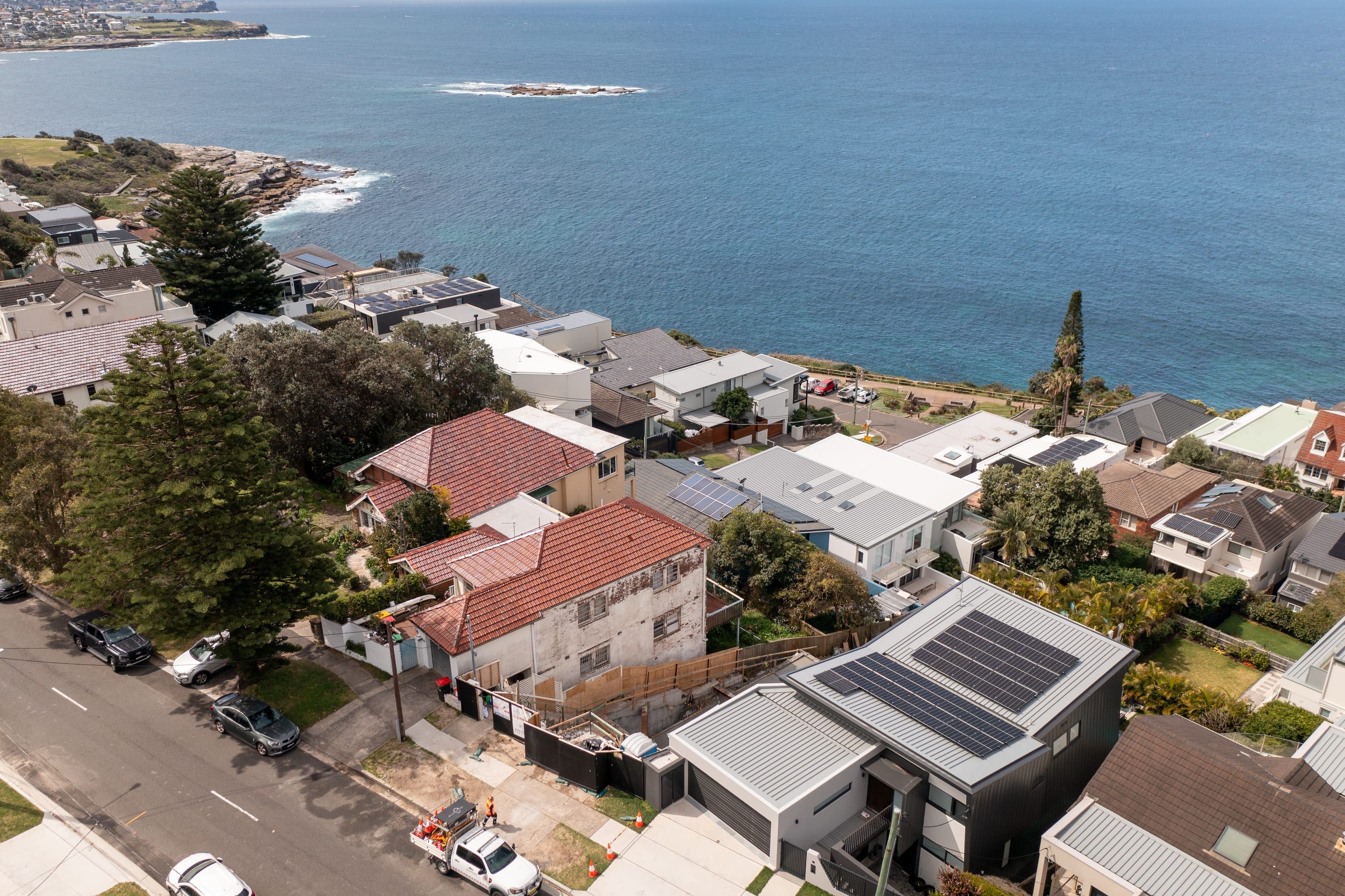 Coogee from above, the build between houses on a street near the coastline, Wedding Cake Island offshore